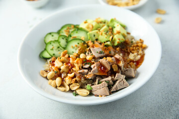 Rice bowl with duck and avocado