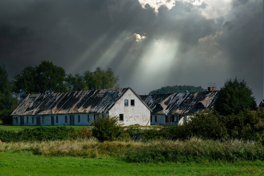clouds over  destroyed houses