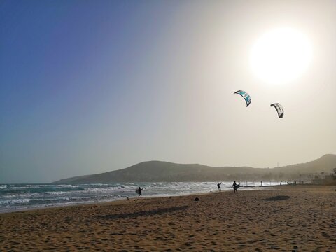 kite surfing on the beach. Kite boarding on the sea under the sun