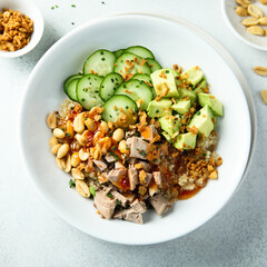 Rice bowl with duck and avocado
