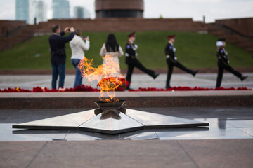 Soviet soldiers WWII memorial in Russia. Flowers lay at an Eternal flame