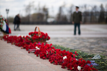 Soviet soldiers WWII memorial in Russia. Flowers lay at an Eternal flame