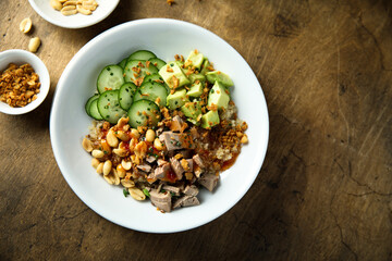 Rice bowl with duck and avocado