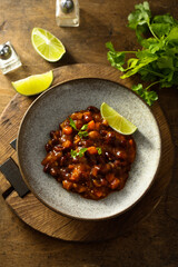 Homemade red bean ragout with vegetables and lime