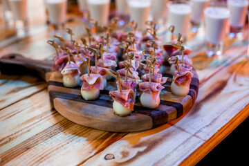 Decorated catering banquet table with different food appetizers assortment on a party