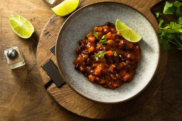Homemade red bean ragout with vegetables and lime