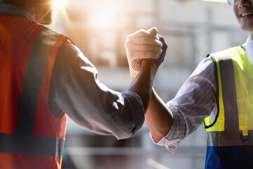 Team Construction or engineering group and worker. Teamwork and determination to succeed. Safety...