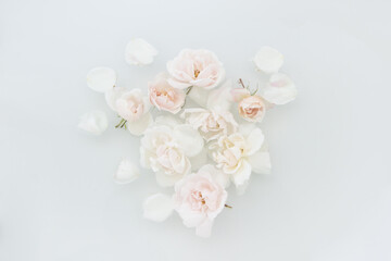 collage and still life of white roses floating in water bath