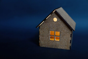 Obraz na płótnie Canvas Miniature house illuminated from inside