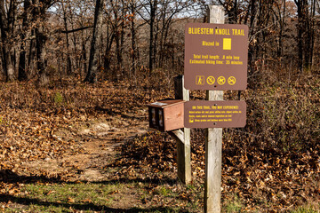 The sign marks Bluestem Knoll Trail and provides other information in Lake of the Ozarks State Park
