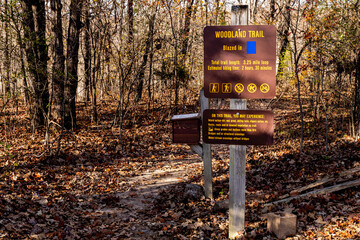 The sign marks Woodland Trail and provides other information in Lake of the Ozarks State Park
