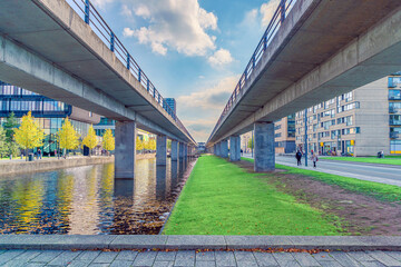 two bridges of the M1 metro subway line and a canal with water near Ørestads Boulevard in the...