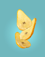 dried candied pears flying on a blue background