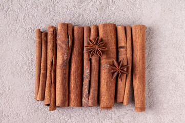cinnamon sticks and star anise on gray plaster
