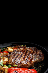 Grilled steak with baked vegetables and mushrooms