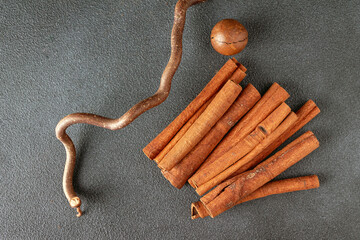 cinnamon sticks, driftwood, copy space, selective focus