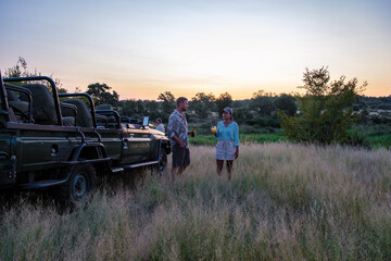South Africa The Klaserie Private Nature Reserve February , luxury safari car during a game drive, couple men and woman on safari in South Africa.  - obrazy, fototapety, plakaty