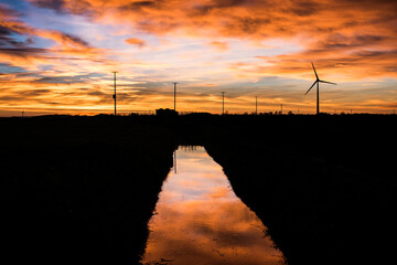 wind turbines at sunset