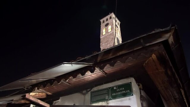 Sarajevo Old Clock Tower at night - the only public clock in the world that keeps lunar time for the daily prayers. Sarajevo, Bosnia and Herzegovina