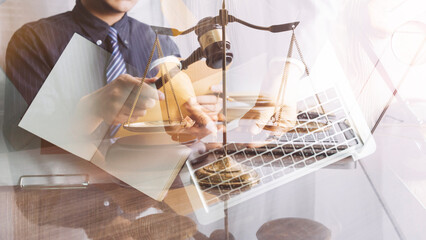 Male lawyer working with contract papers and wooden gavel on tabel in courtroom. justice and law ,attorney, court judge, concept.