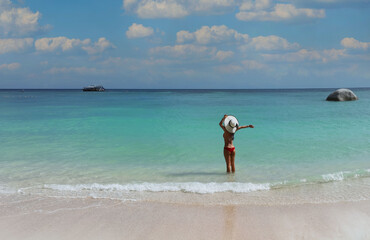 Young woman  in colorful of bikini Enjoy life and freedom mood with bluet sky scene background