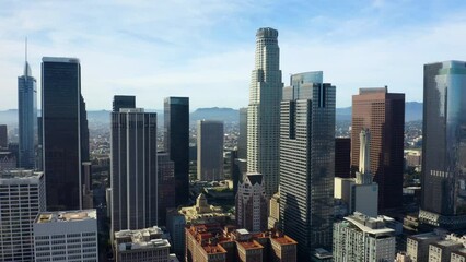 Financial skyscrapers. Business district with skyscrapers. Rising drone shot from residential buildings. Aerial view of cityscape. Urban aerial view of beautiful and scenic downtown Los Angeles. 