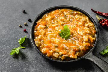Healthy vegan mushroom stew in cast iron skillet. Top view, copy space.