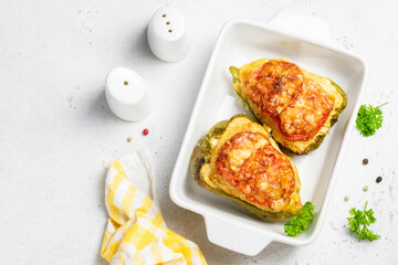 stuffed bell peppers in baking dish. Top view, copy space, flat lay.