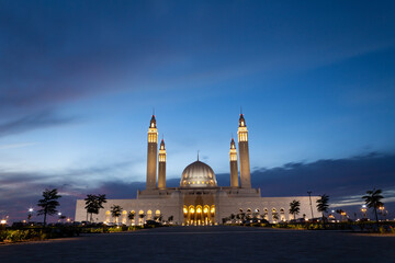 A view of Sultan Qaboos Mosque at the blue hour
