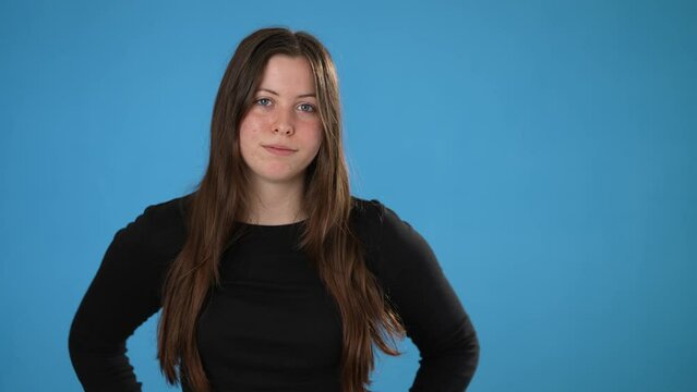 Tired Exhausted Displeased Brunette Young Woman 20s Wearing Casual Black Shirt Posing Isolated On Blue Background Studio. People Lifestyle Concept.