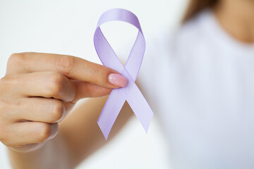 Woman with blue ribbon, prostate cancer awareness
