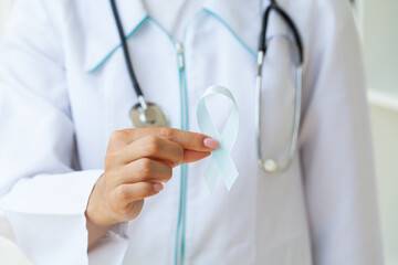 Woman with blue ribbon, prostate cancer awareness