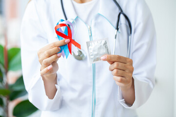 Female doctor holds colored ribbons symbolize awareness of various diseases