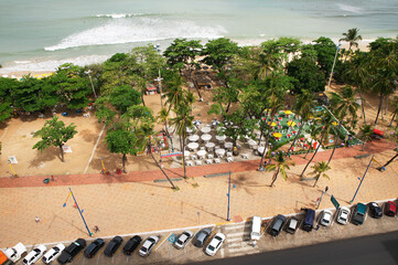 Cars parked in front of park. Photographed from above