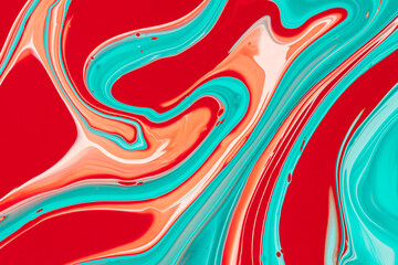 Colorful paints blended on a fluid art texture. A backdrop with colored waves and paints creeks. Modern abstract background that was created by mixing inks with liquid and smooth shapes and swirls.