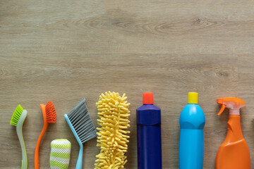 House cleaning plastic product on wood table background, home service or housekeeping concept