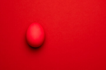 Red Easter egg on a red background.
