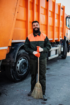 Portrait Of A Young Worker Of The City Utility Company. Garbage Collector.