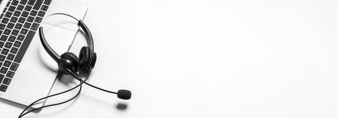 Headset and customer support equipment at call center ready for actively service , Communication support, call center and customer service help desk.for (call center) concept .