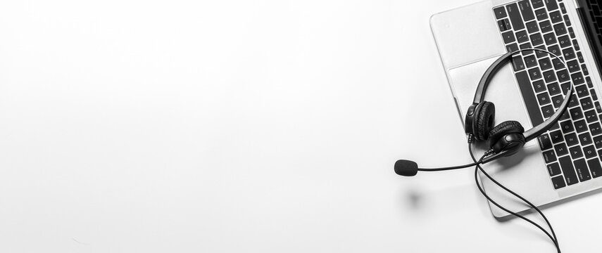 Headset and customer support equipment at call center ready for actively service , Communication support, call center and customer service help desk.for (call center) concept .