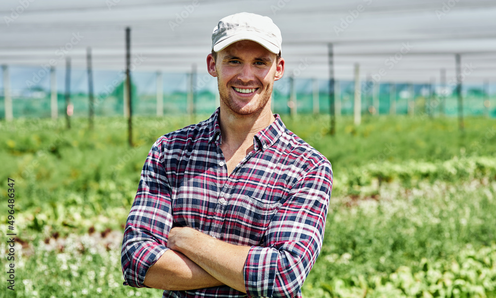 Wall mural farming has always been in my blood. portrait of a handsome young farmer posing outdoors on his farm