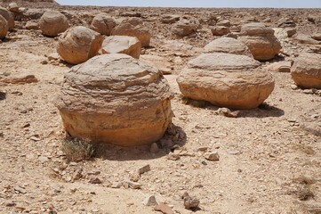 Unreally spherical rocks concretions in Nahal Keidar reserve, South Israel, sunset time, twilight