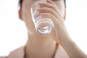 Close up of woman drinking glass of water