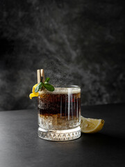 a glass with a carbonated sweet non-alcoholic drink. place for text