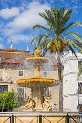 Fountain spraying water on the central market square of Merida, Spain