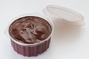Acai in transparent plastic packaging isolated on white background. Fruit from the Brazilian Amazon.