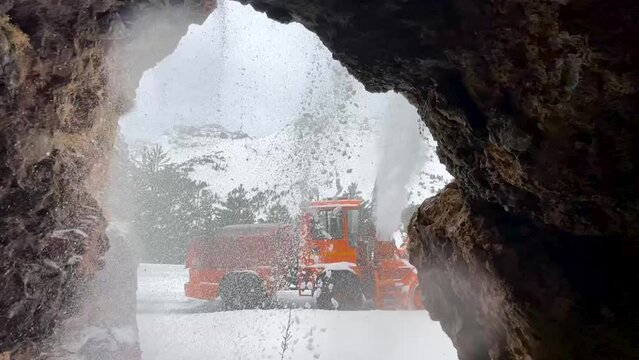 operation of the snowblower to open the road for service