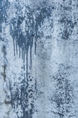 Blue painted concrete surface old stained paint wall texture spilled cement streaks background