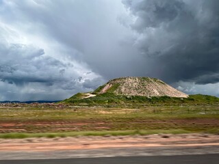 Rain clouds over dry land
