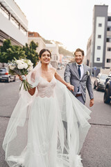 Im taking this one home. Shot of a beautiful couple out in the city on their wedding day.